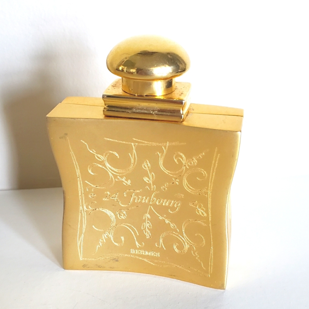 Hermès 24 Faubourg gold-tone metal perfume atomizer.